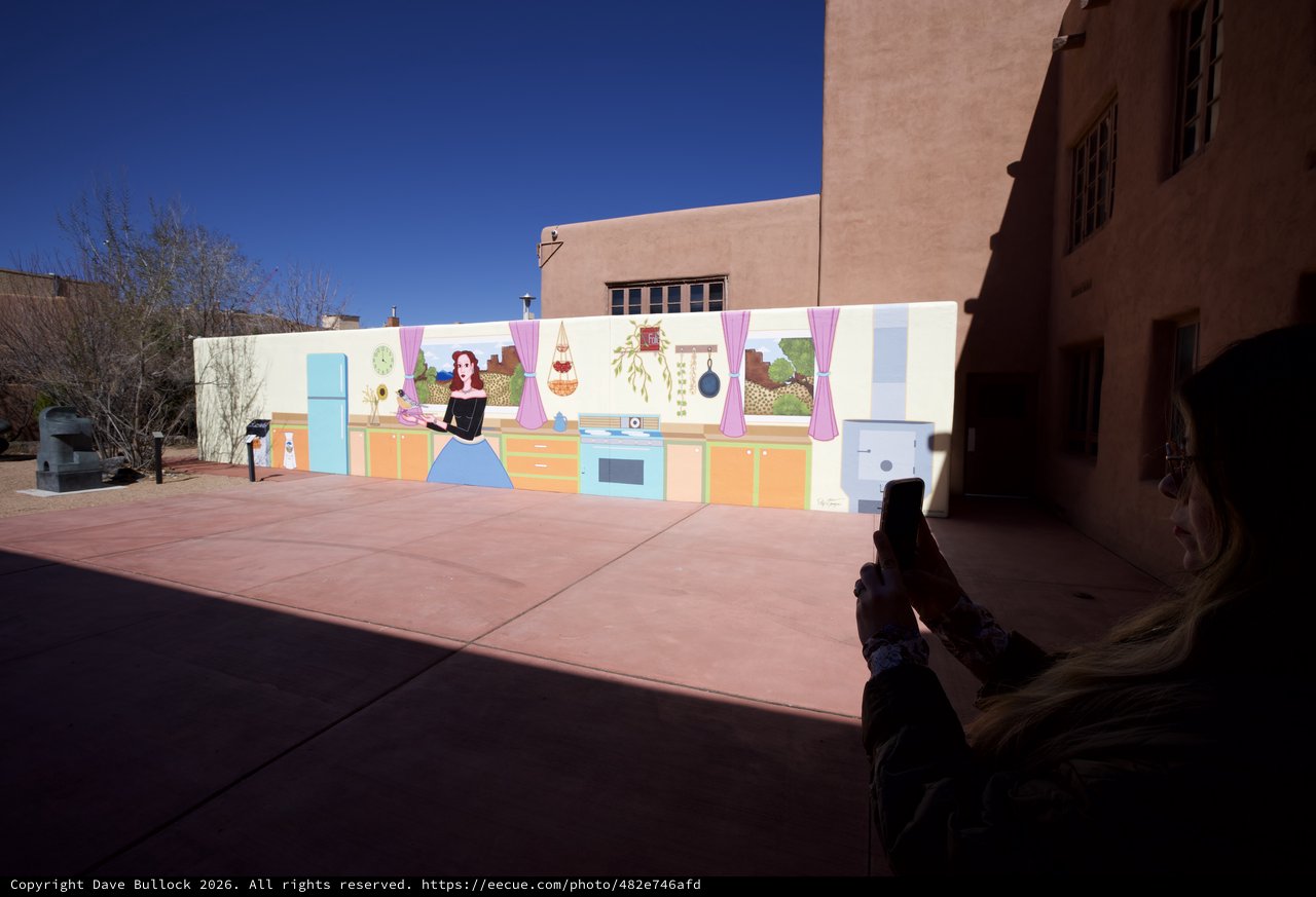 Tourist Photographing Colorful Kitchen Mural in Santa Fe