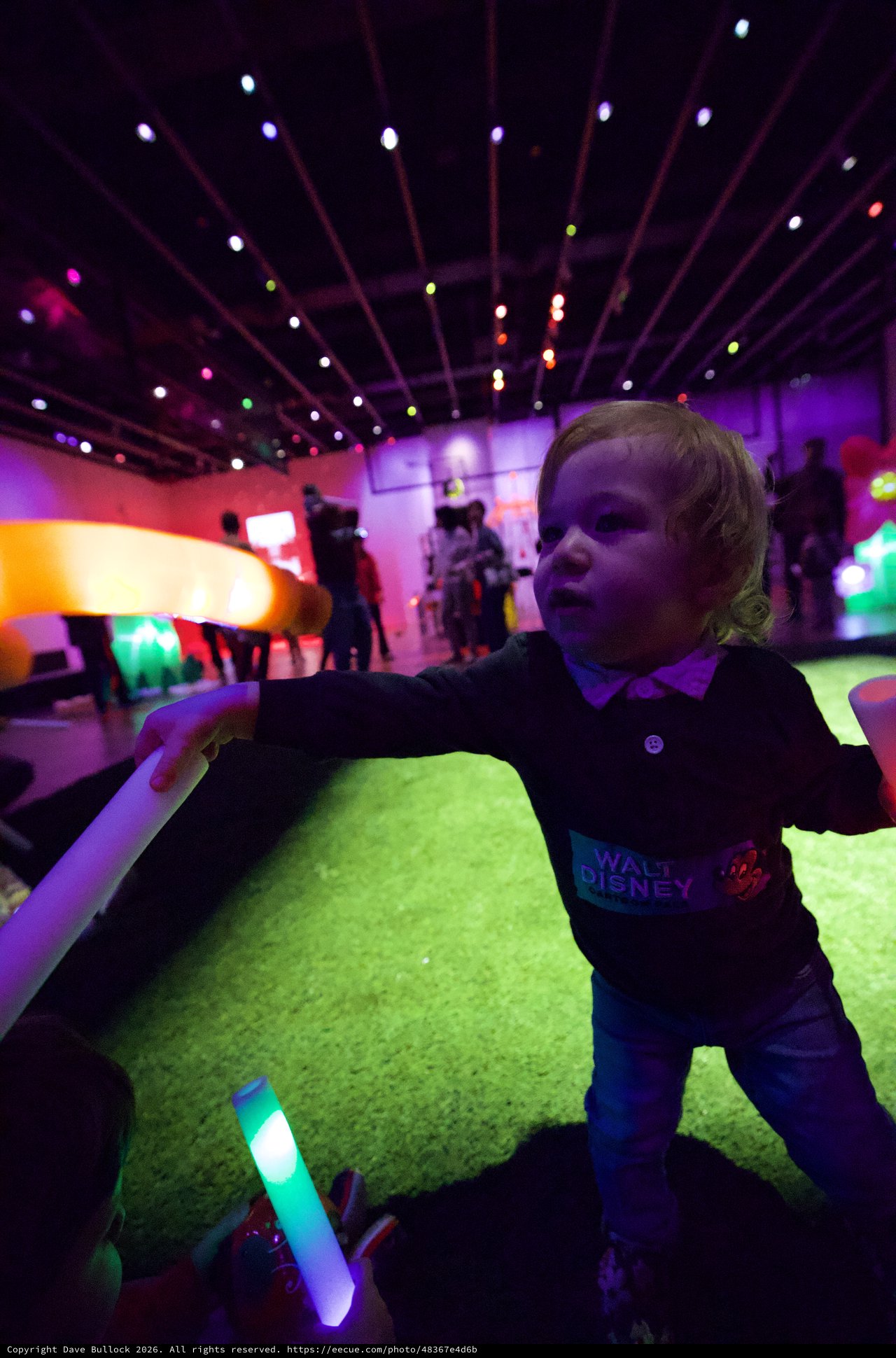 Child Experiencing Immersive Light Installation at Baby Rave