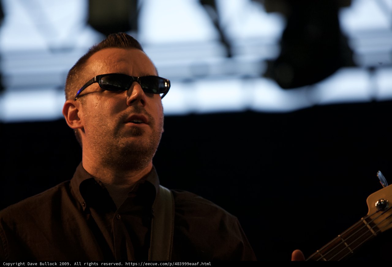 Man in sunglasses rocking out on stage