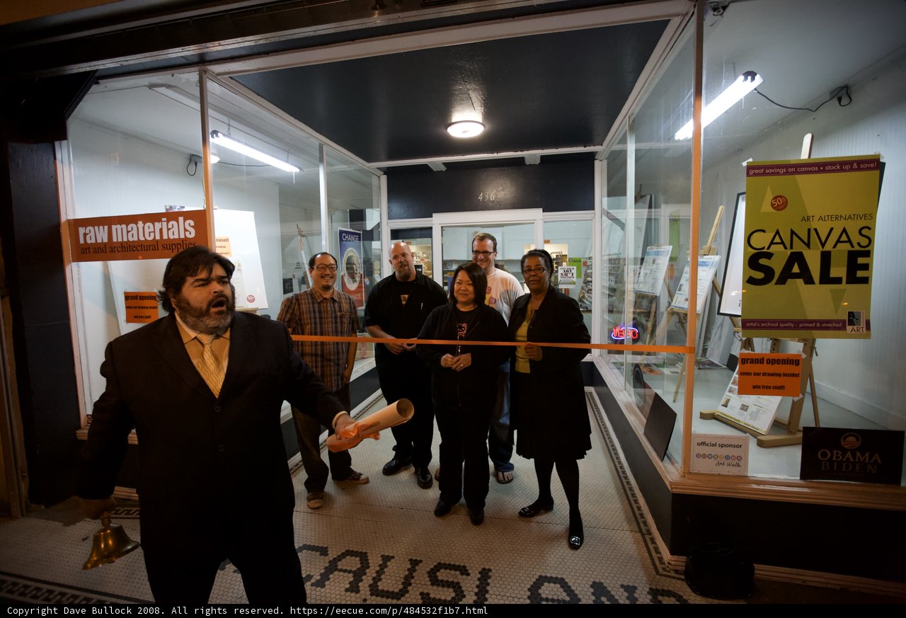 Group of People Admiring Display in Front of Store