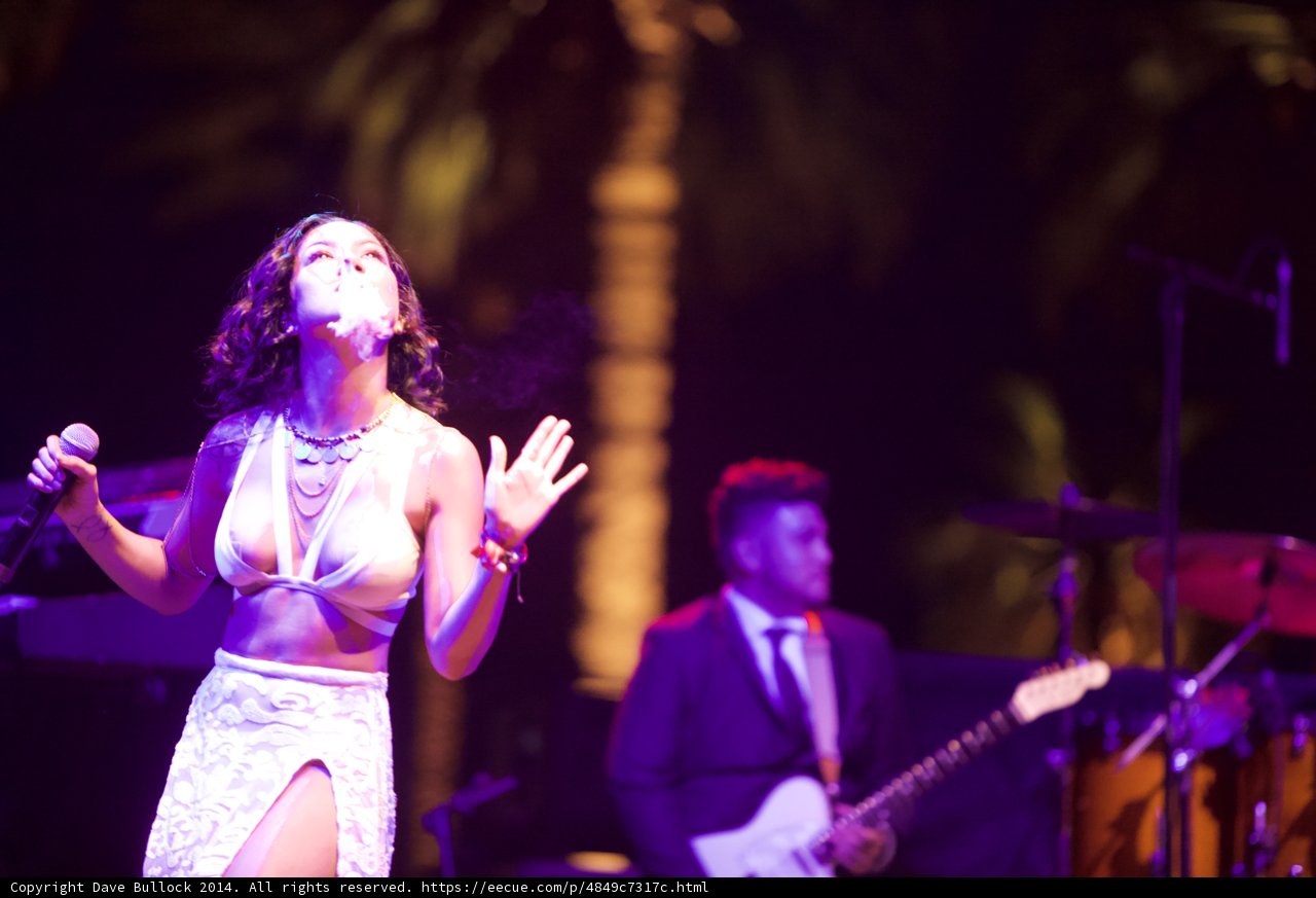 Rocking the Stage in a Bikini Top and Skirt