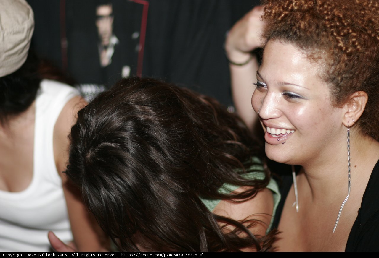 Curly-Haired Woman in Funky Club