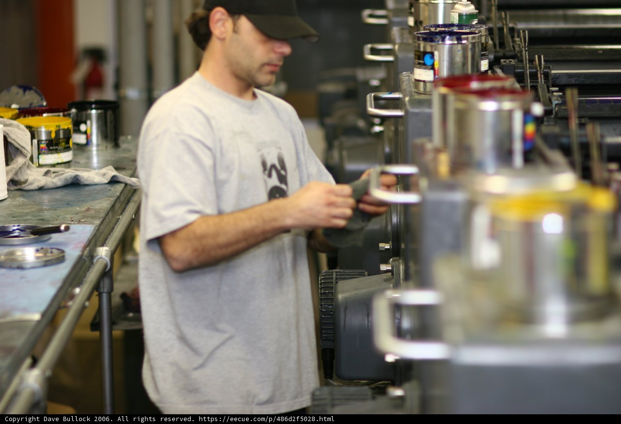 Gray Shirted Man in Factory