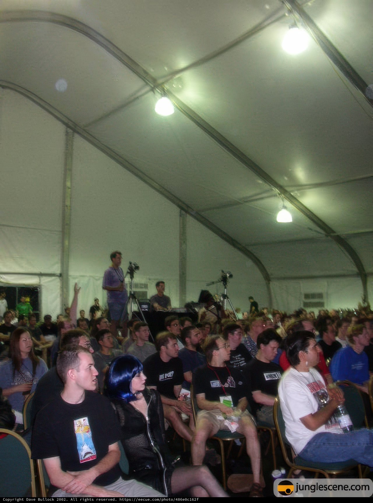 Crowd Gathers for Video Screening in Tent