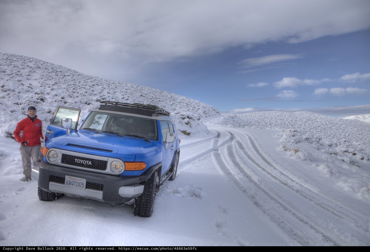 Blue Toyota FJ Cruiser on Snowy Mountain Road