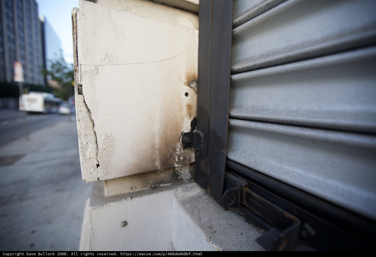 Rusty Metal Door with Broken Window