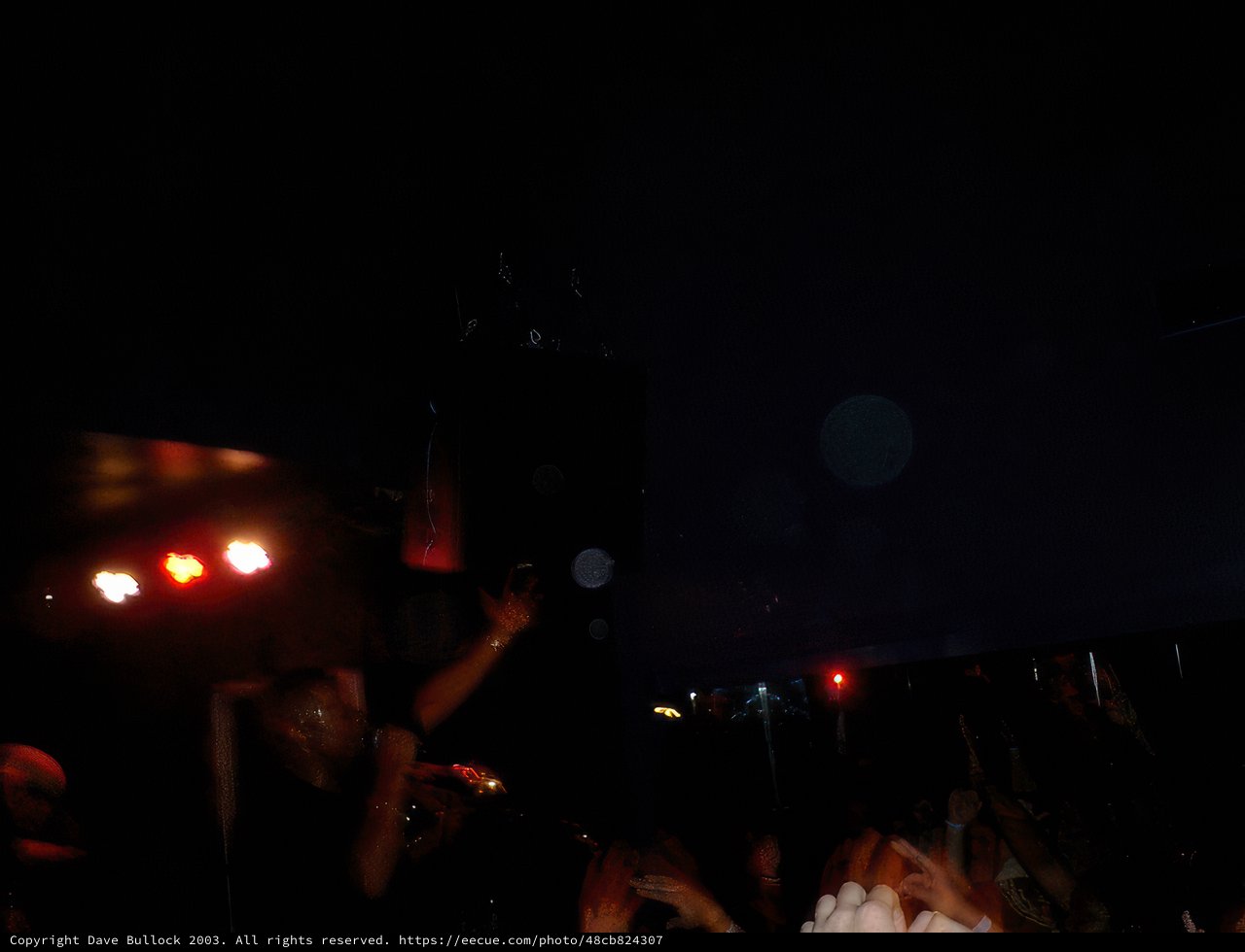 Nightclub Party Crowd with Vibrant Lighting