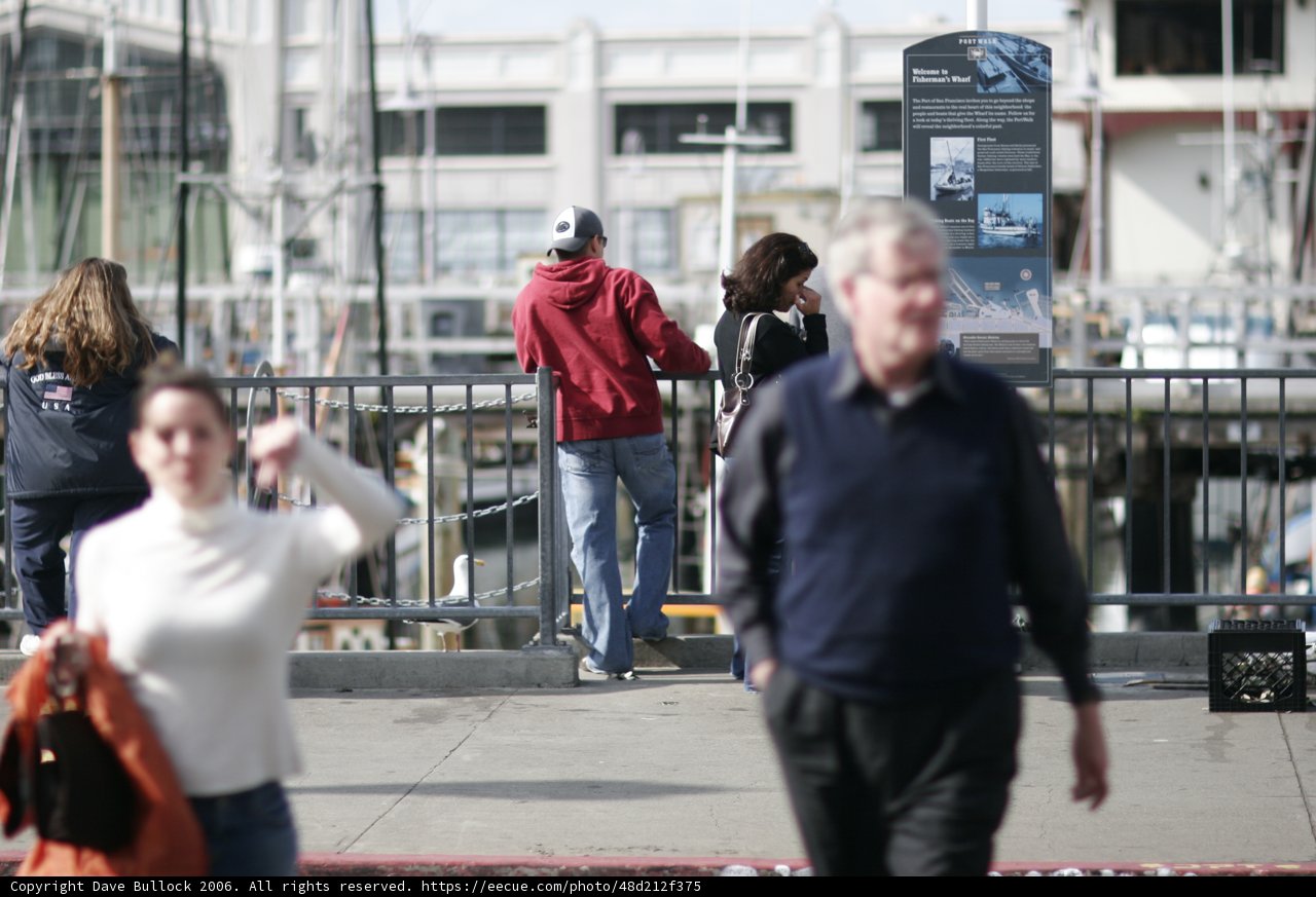Man Walking on Sidewalk