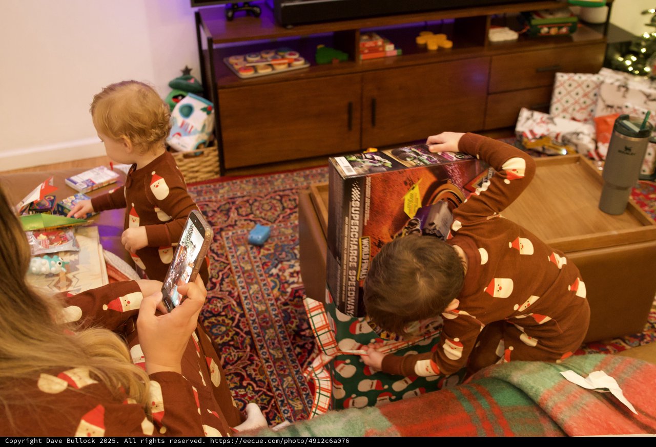 Christmas Morning Gift Opening in Matching Pajamas