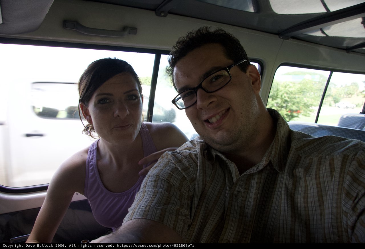 Friends Smiling Inside a Vintage VW Bus