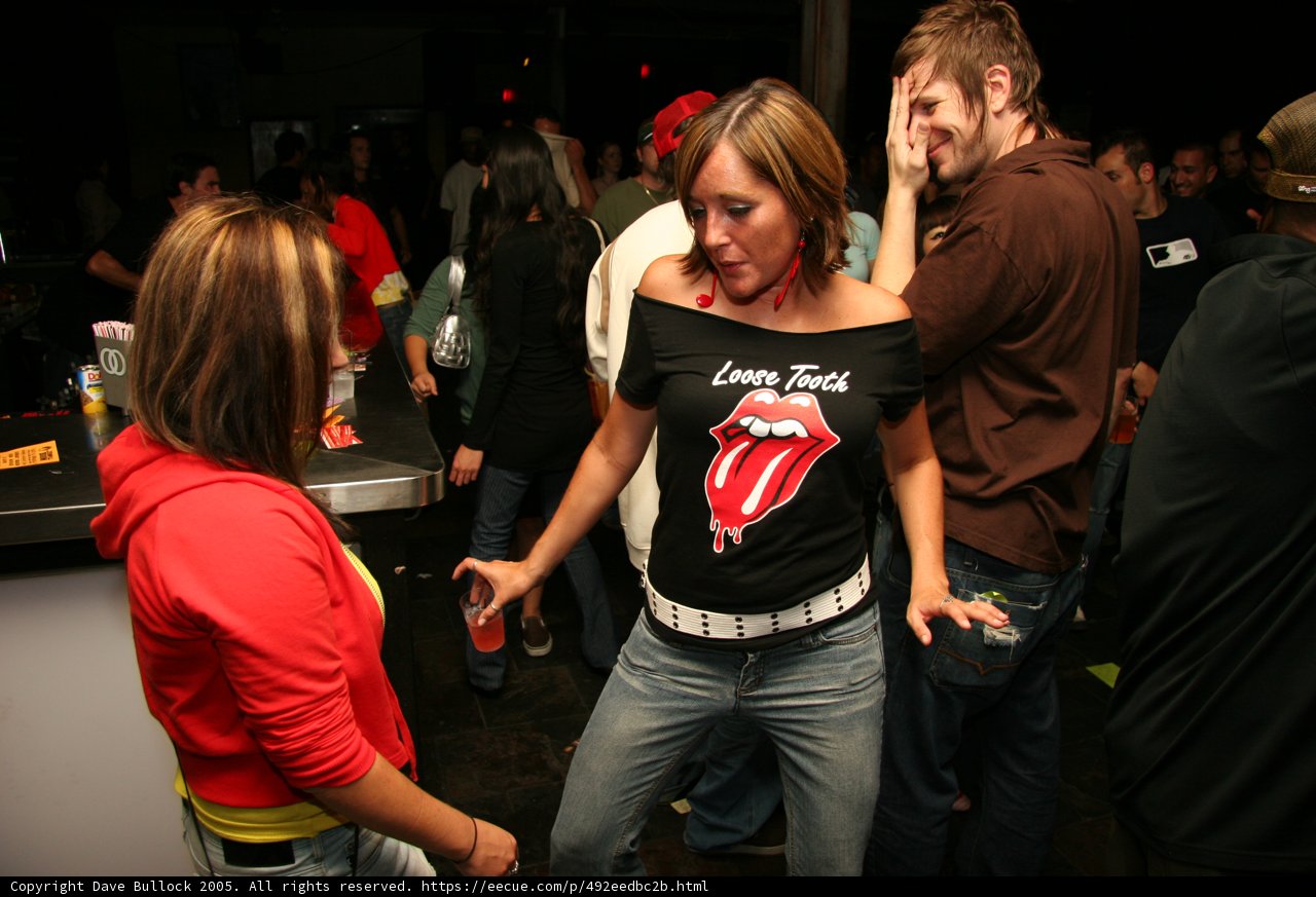Black T-Shirt in a Crowded Club