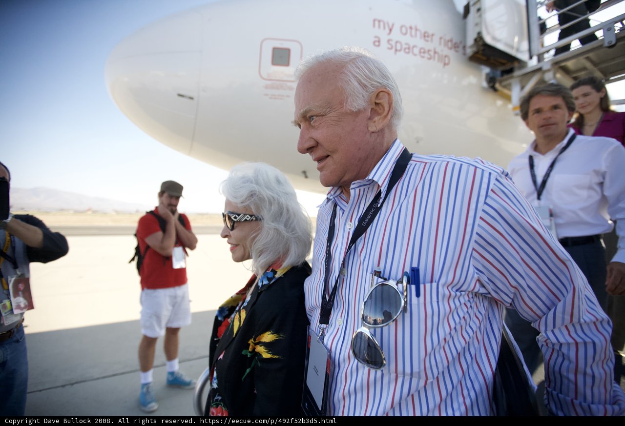 Buzz Aldrin with fans at an airfield
