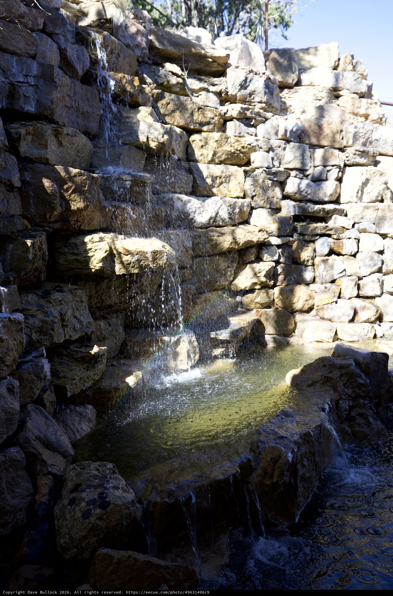 Natural Stone Waterfall Feature in Terraced Rock Garden