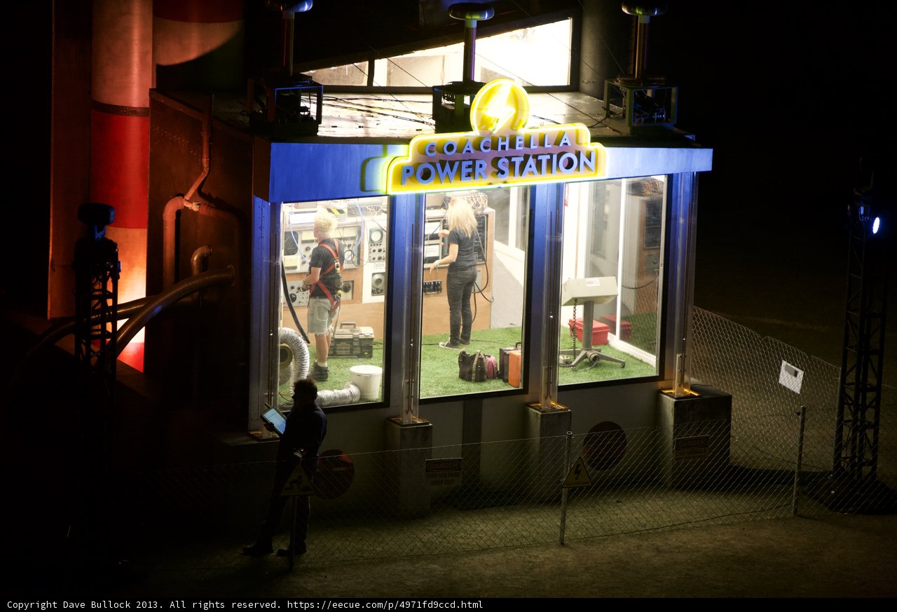 Man Standing in Front of Kiosk Sign