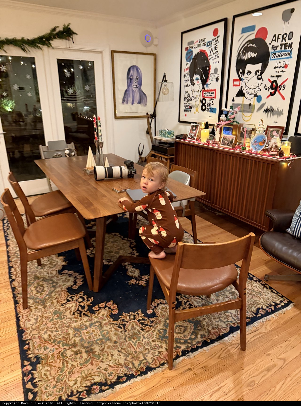 Toddler Standing on Chair in Mid-Century Modern Dining Room
