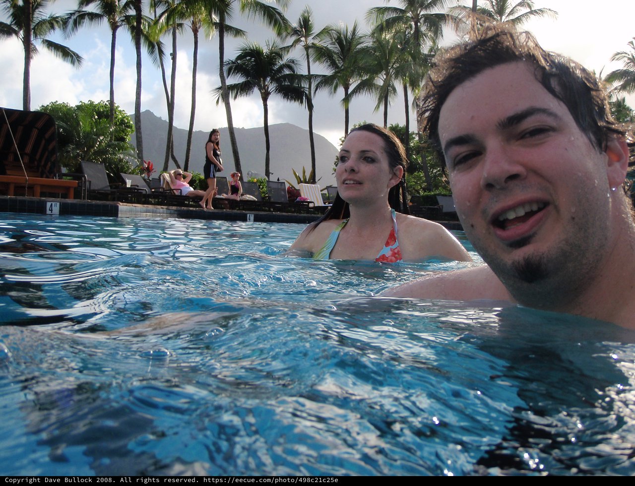 Couple Enjoying Resort Pool in Tropical Hawaii