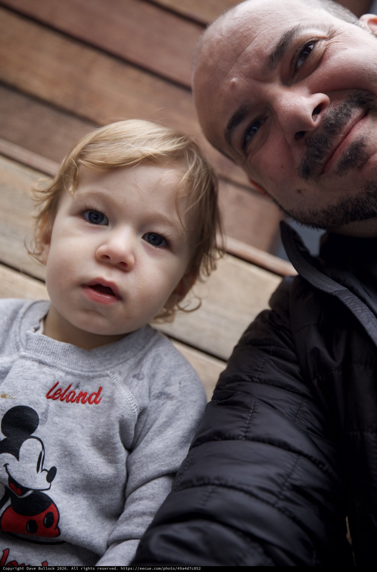 Father and Toddler Selfie on Wooden Deck
