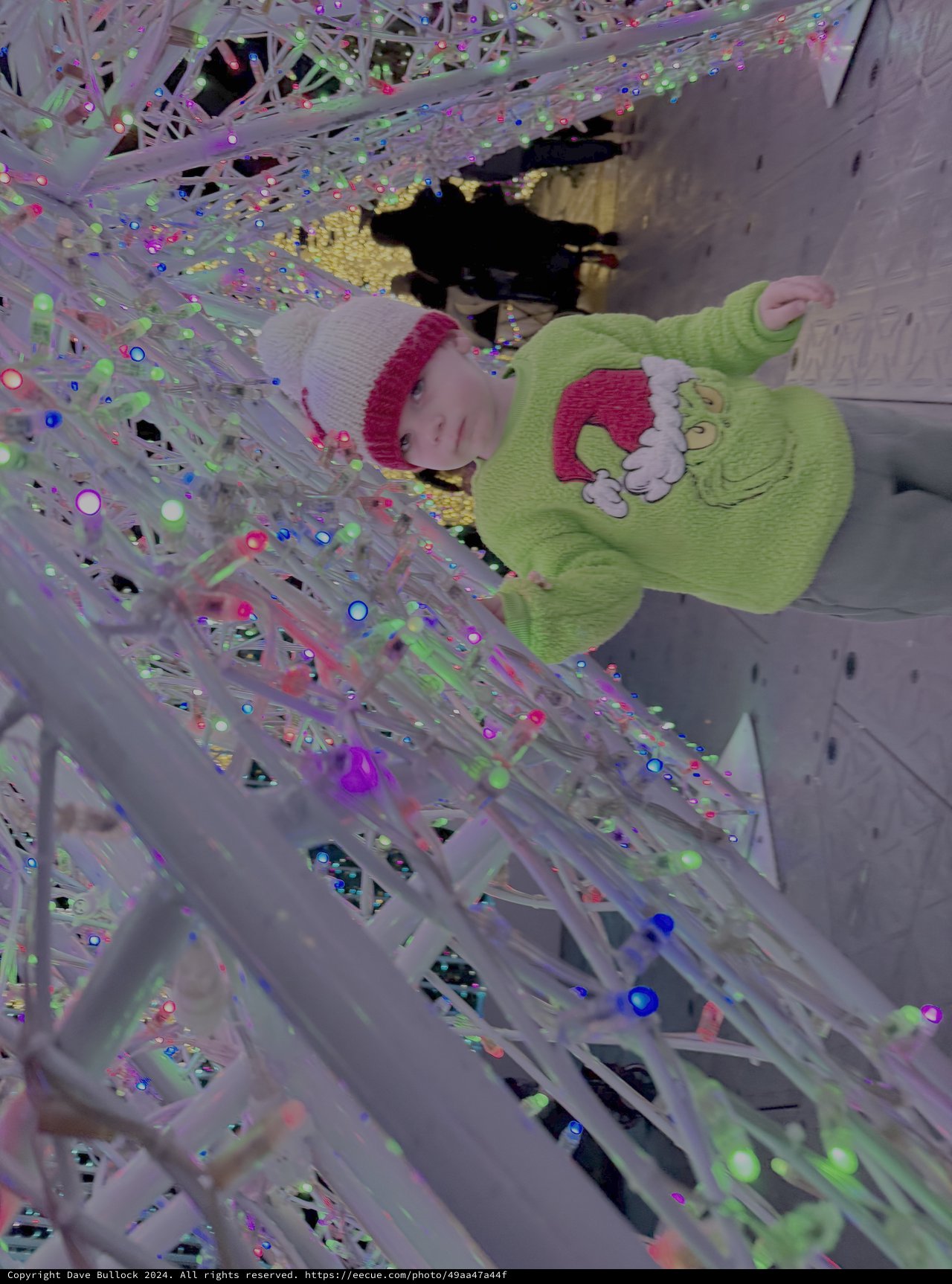 Child Playing in Reflective Metallic Installation Art