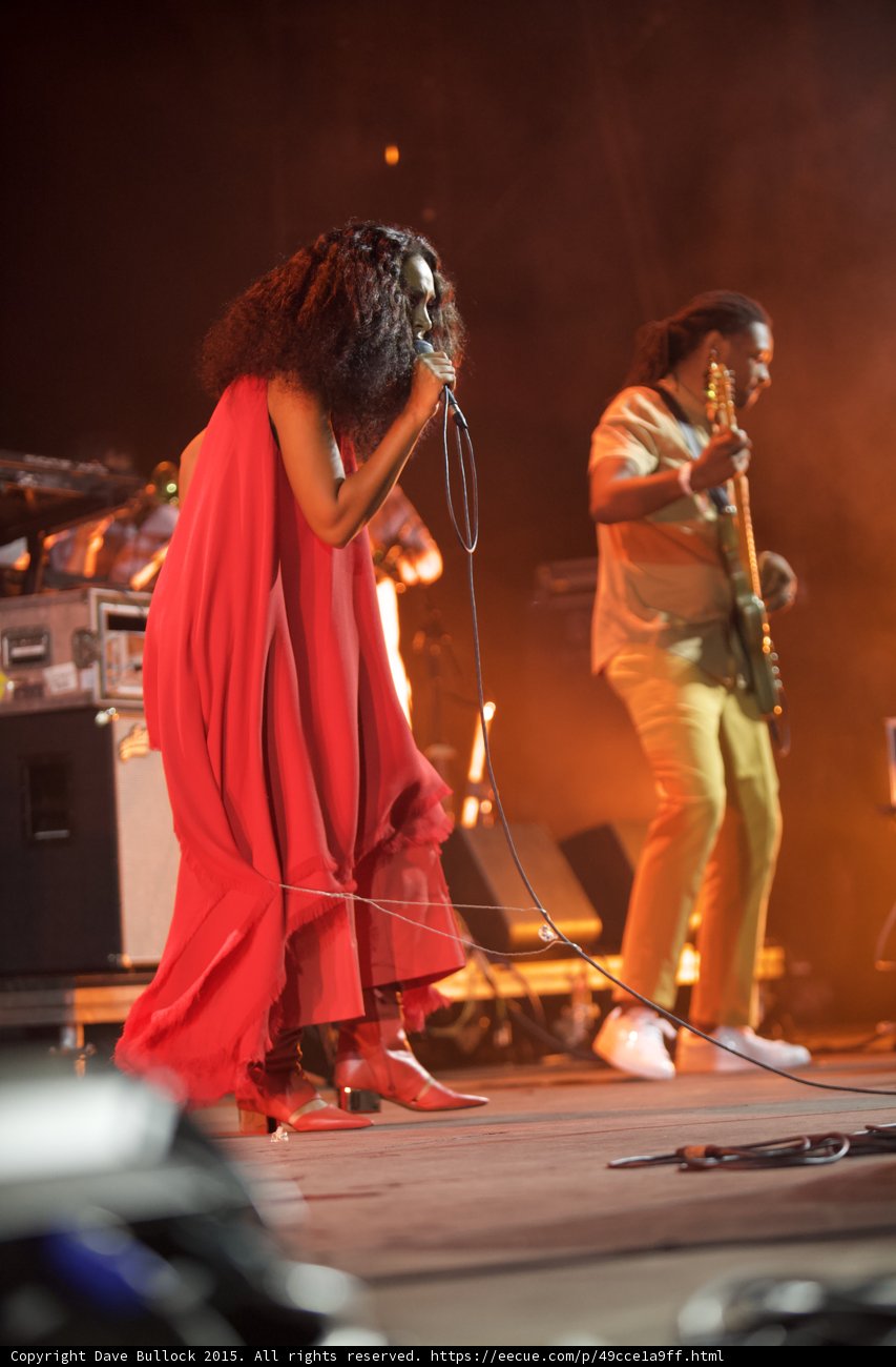 Solange Full Body Profile Red Outfit Guitarist Warm Orange