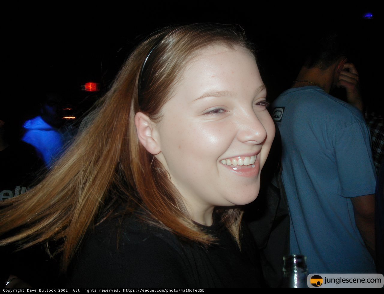 Long-Haired Beauty at a Night Club