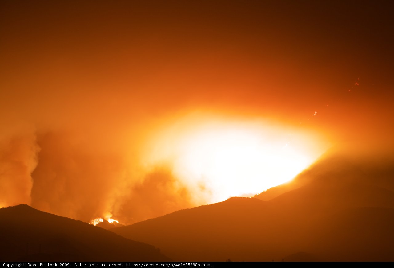 Flames Light Up the Night Sky in the Mountains