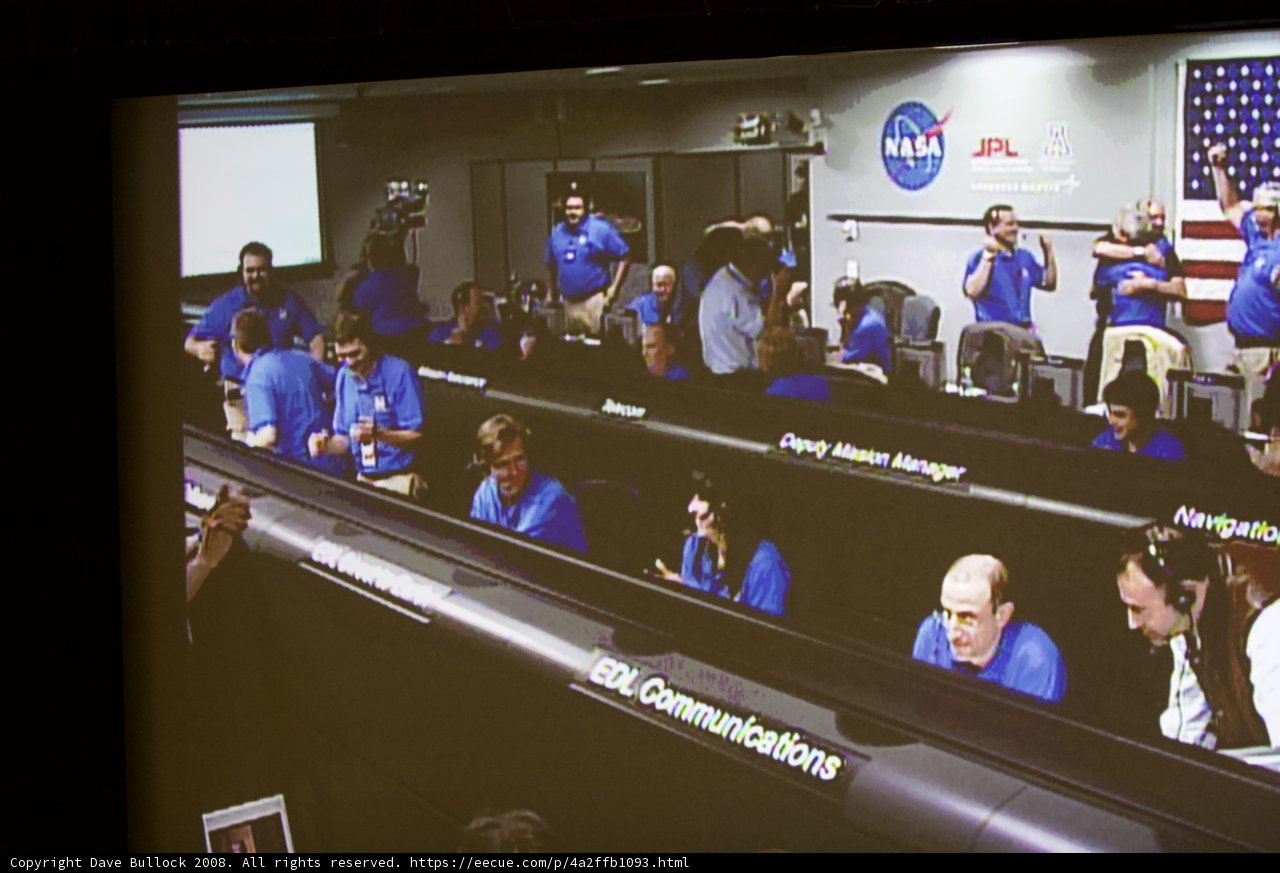 Blue-clad Crowd in Conference Room