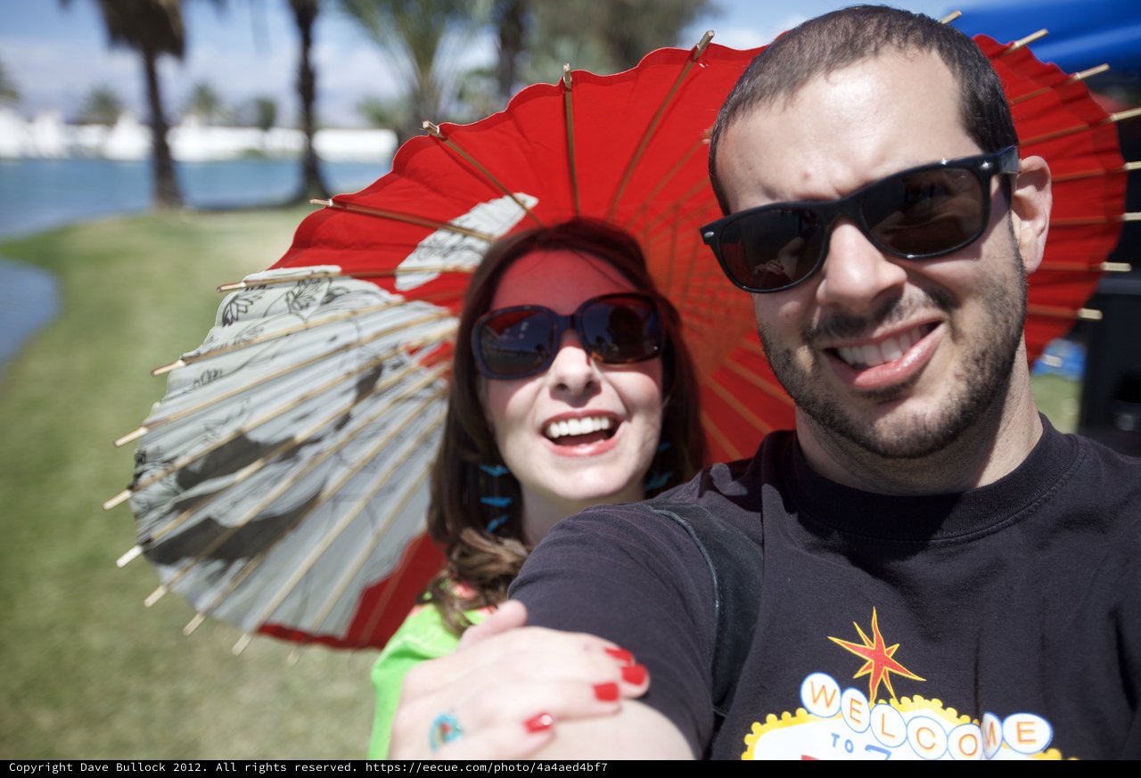 Sunny Festival Selfie with Red Parasols at Coachella