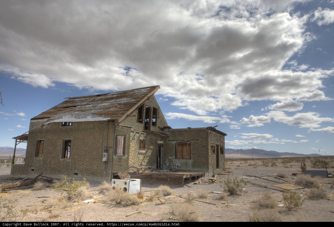 Deserted Hut under a Cloudy Sky
