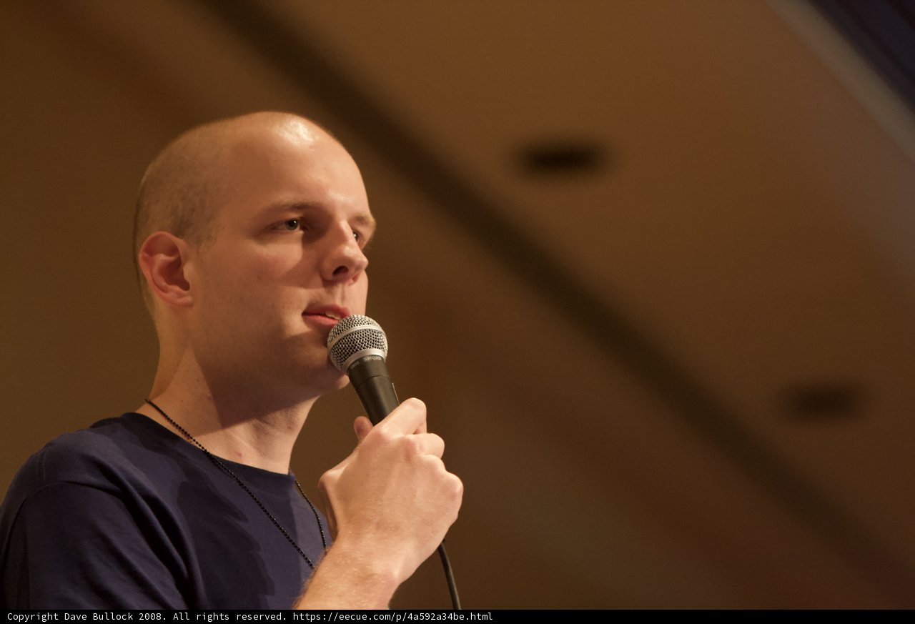 Bald Man Delivers Electrifying Performance with Microphone