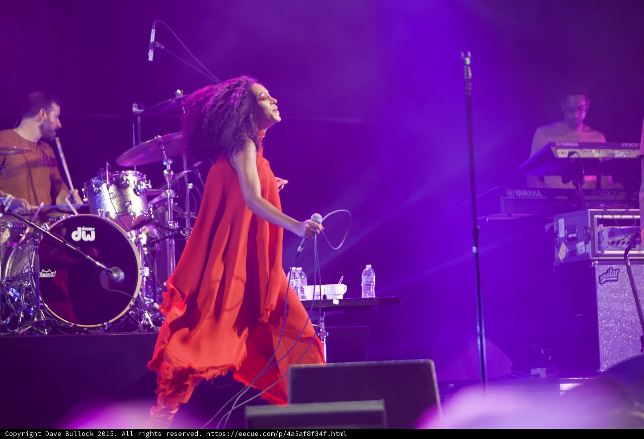 Solange Full Body Dancing Red Dress Profile DW Drums Keyboardist Yamaha Aguilar Amp Purple
