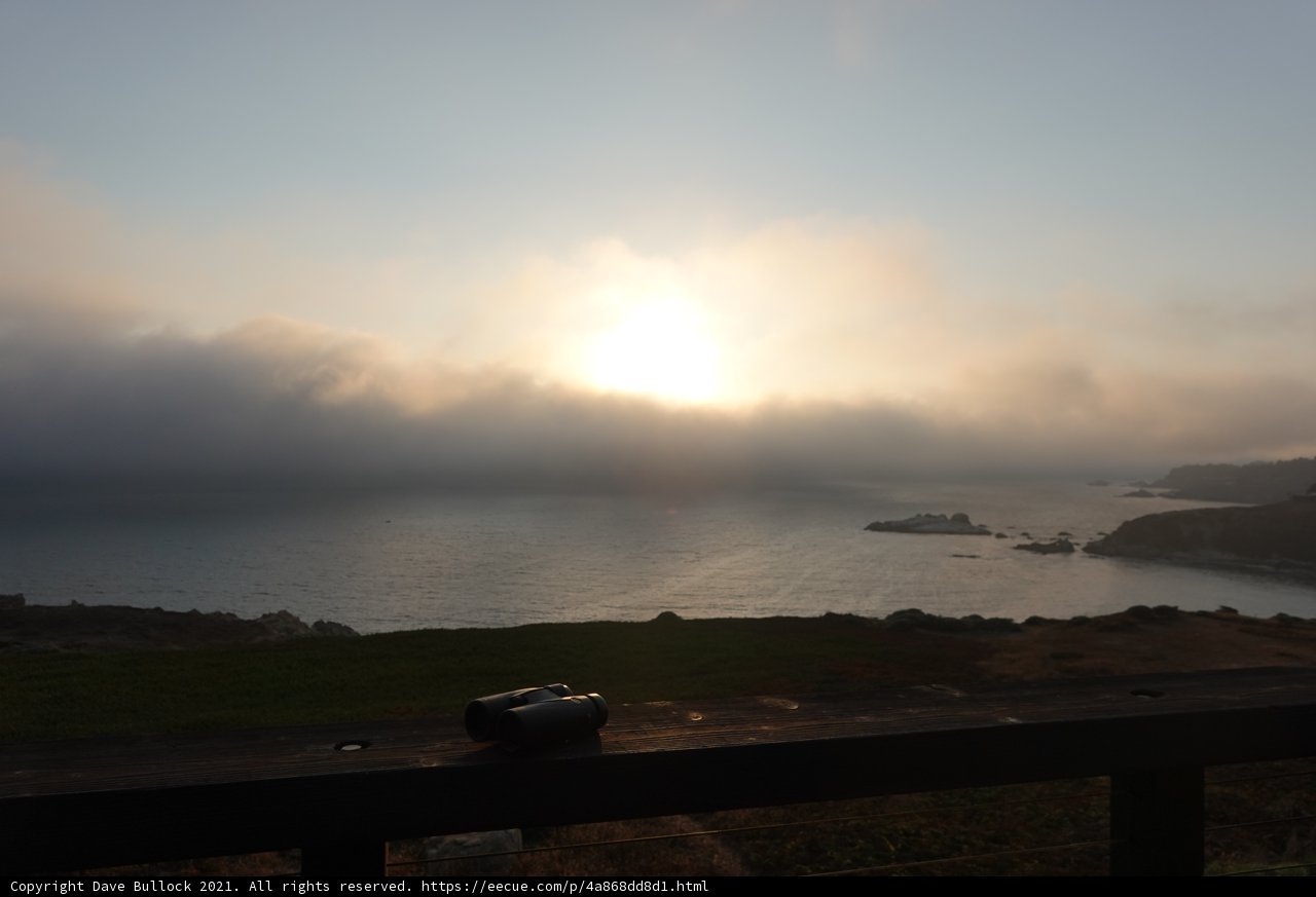 Serene Sunset over the Foggy Sea