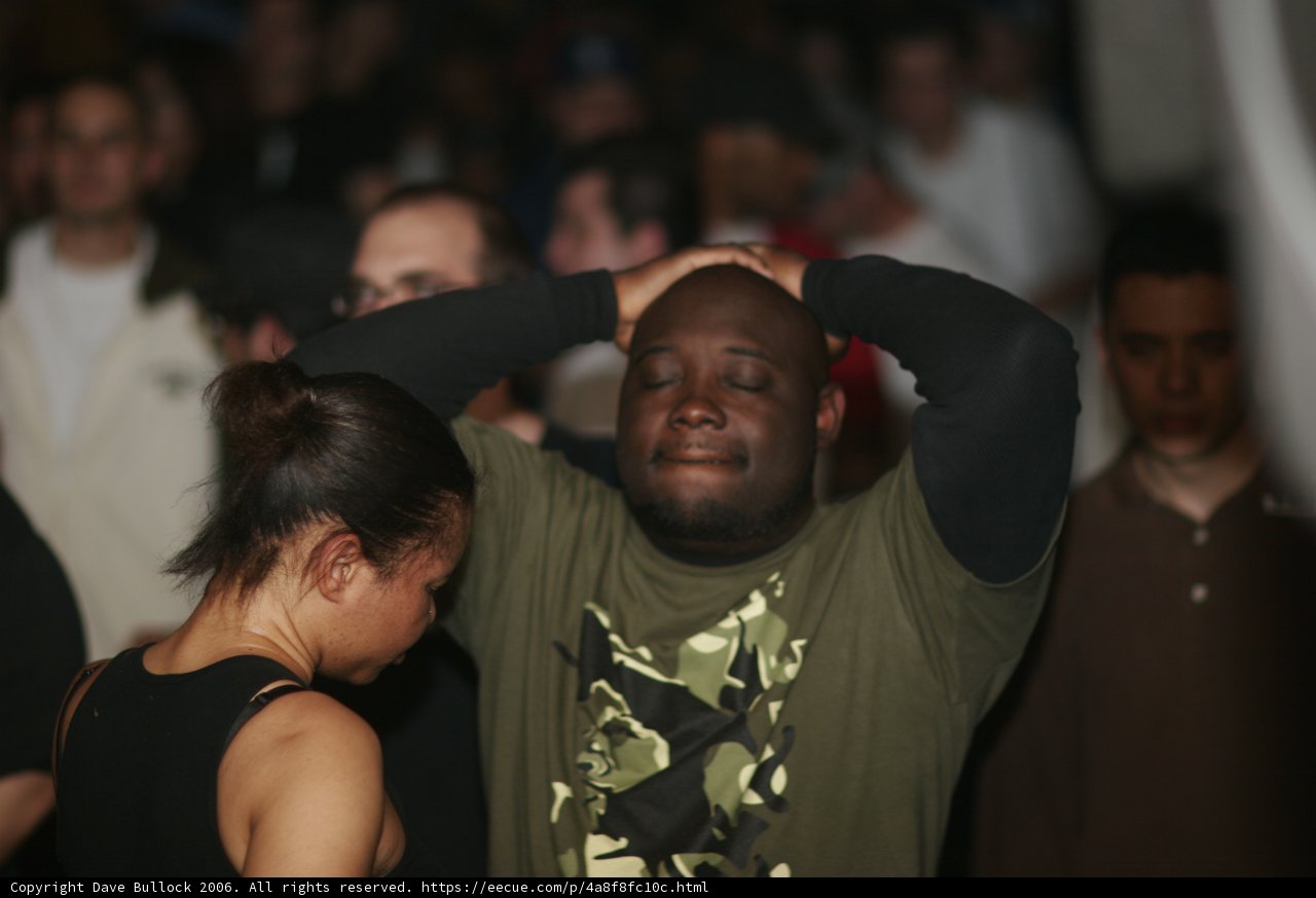 Green-shirted Man in the Club Crowd