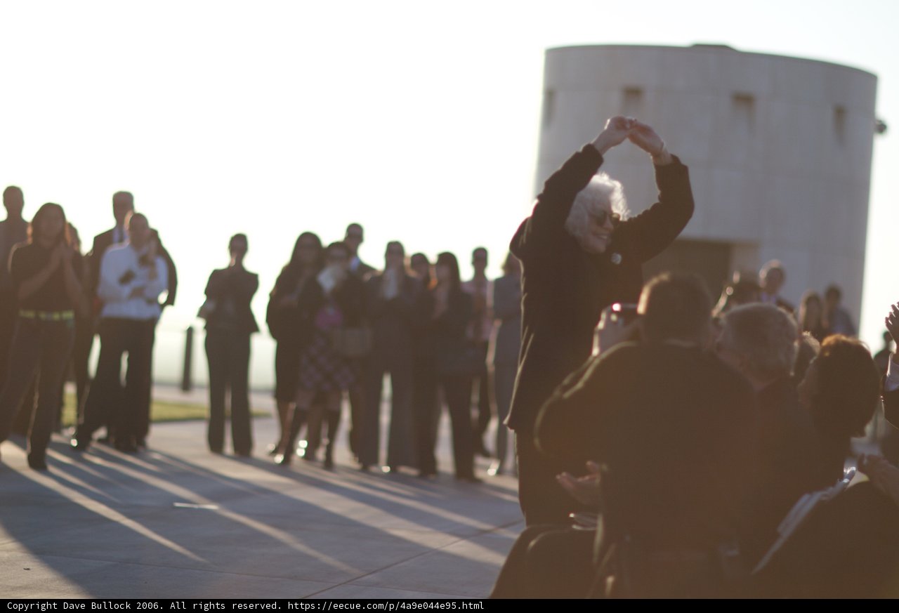 Man in Suit Addresses 20-Person Crowd