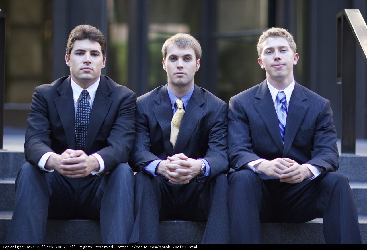 Three Men in Suits Take a Seat