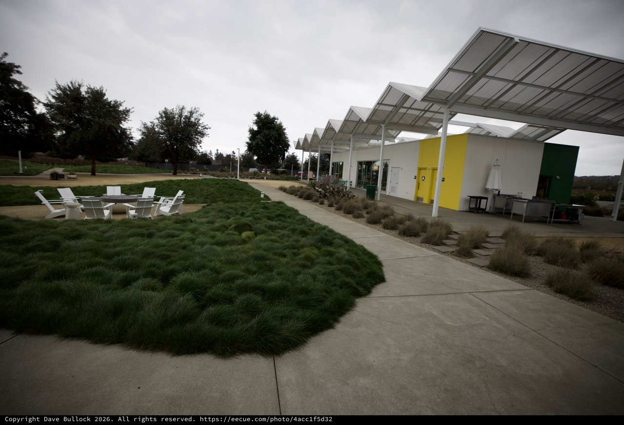 Modern Pavilion with Zigzag Roofline and Outdoor Seating