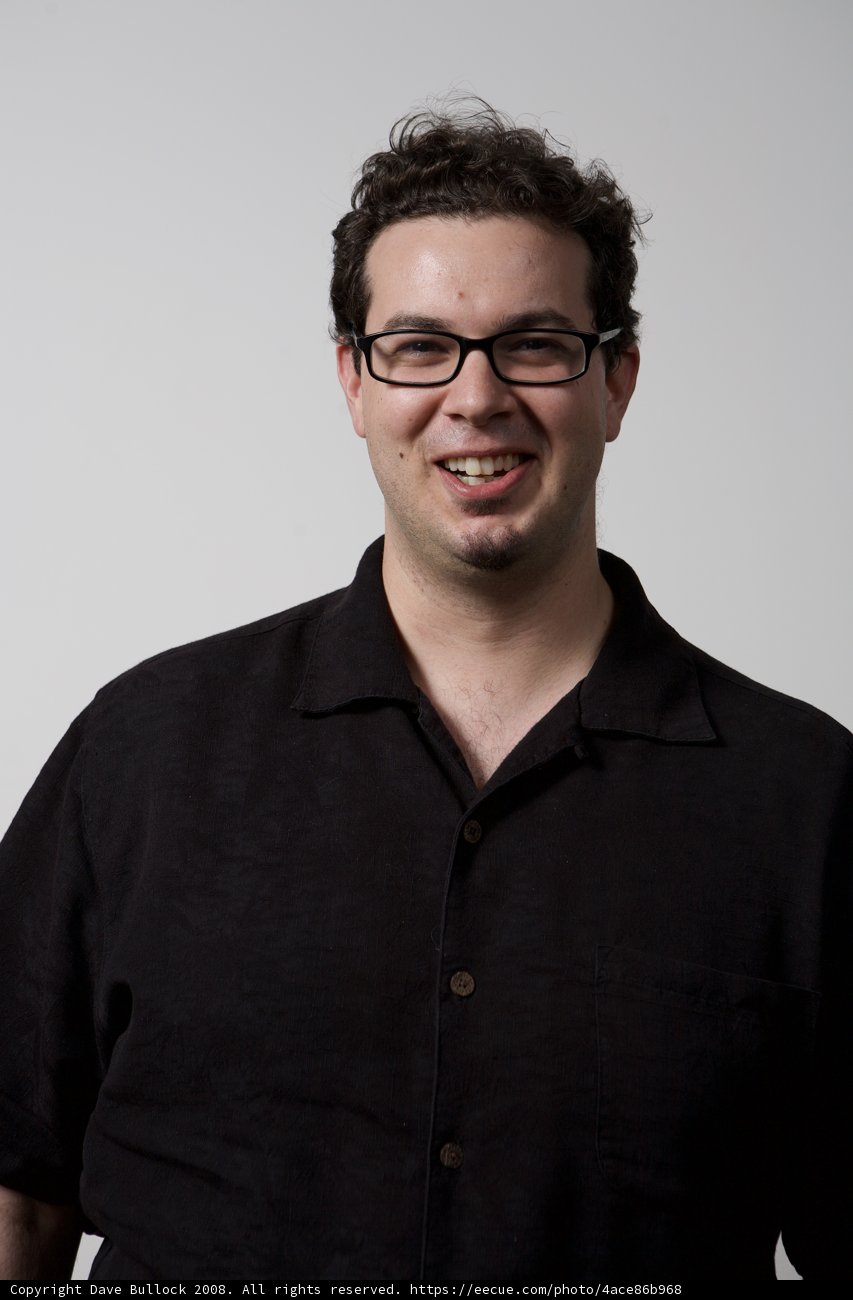 Smiling Dave B in Black Shirt and Glasses