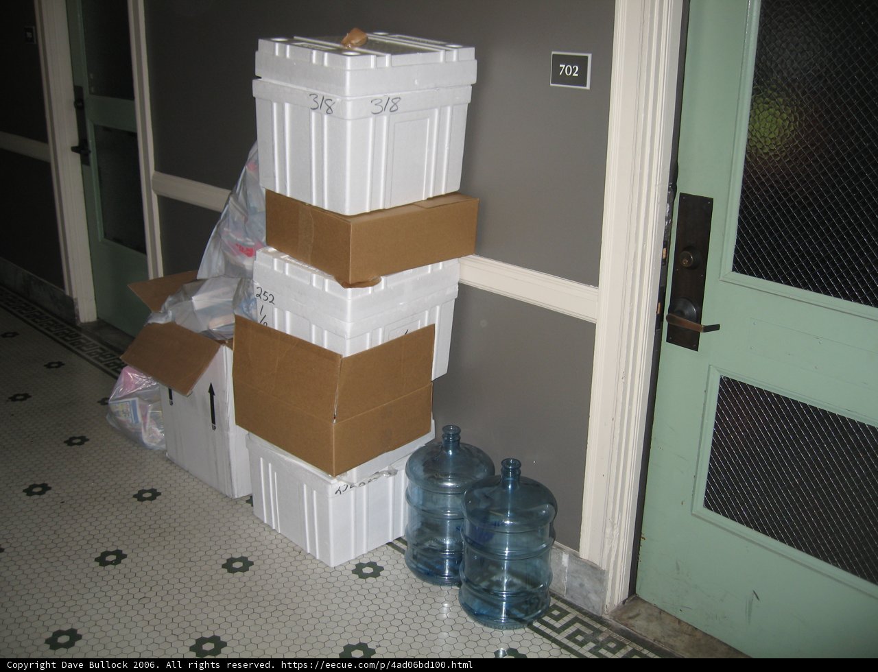 Stack of Boxes and Water Bottle on the Floor