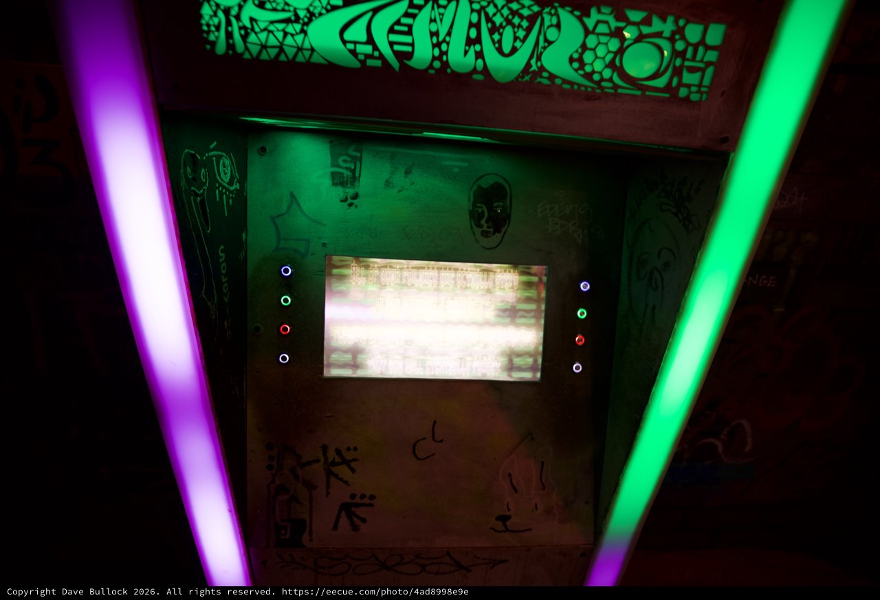 Retro Arcade Cabinet with Glowing Neon Lights