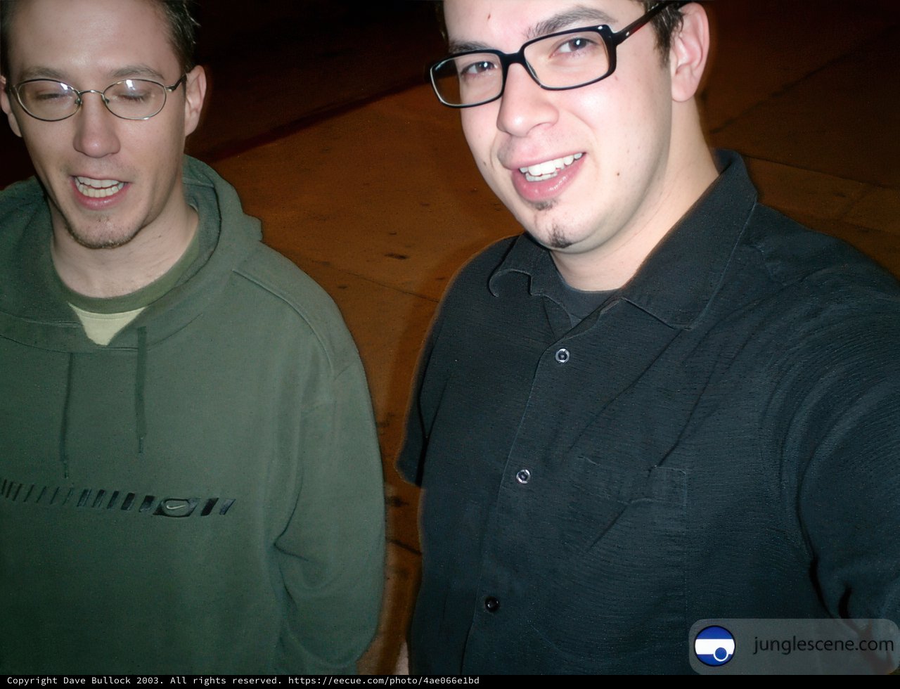 Two Men in Glasses Pose for a Portrait