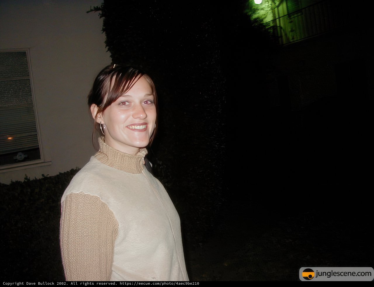 Nighttime Portrait of a Smiling Woman