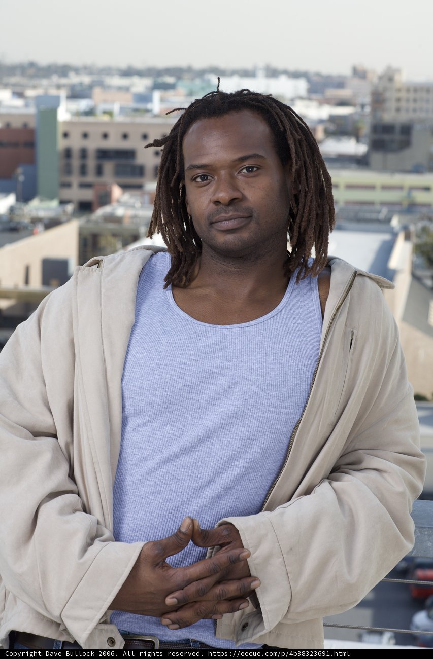 Dreadlocked James in Front of Building