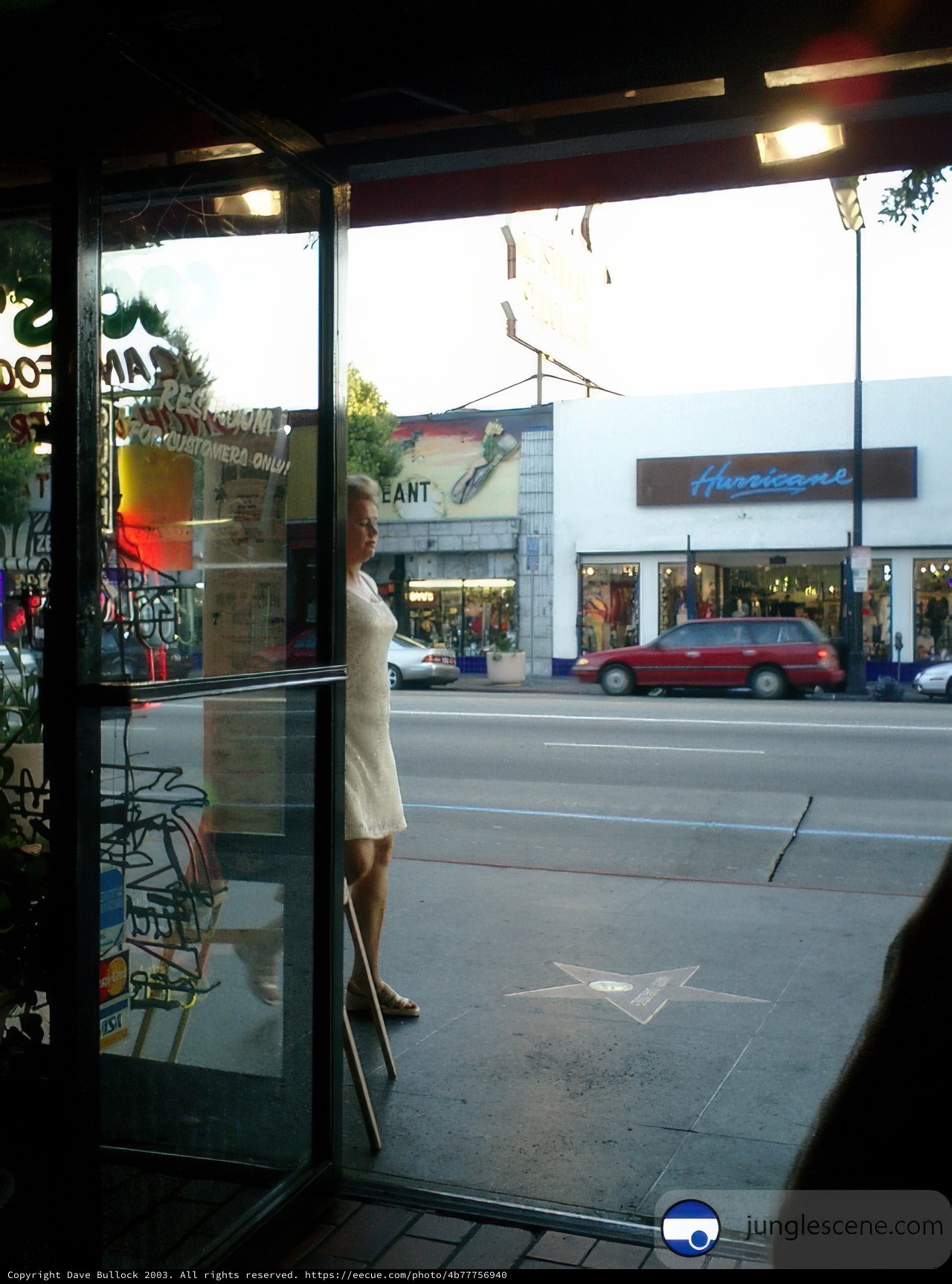 Bride-to-be in front of City Storefront