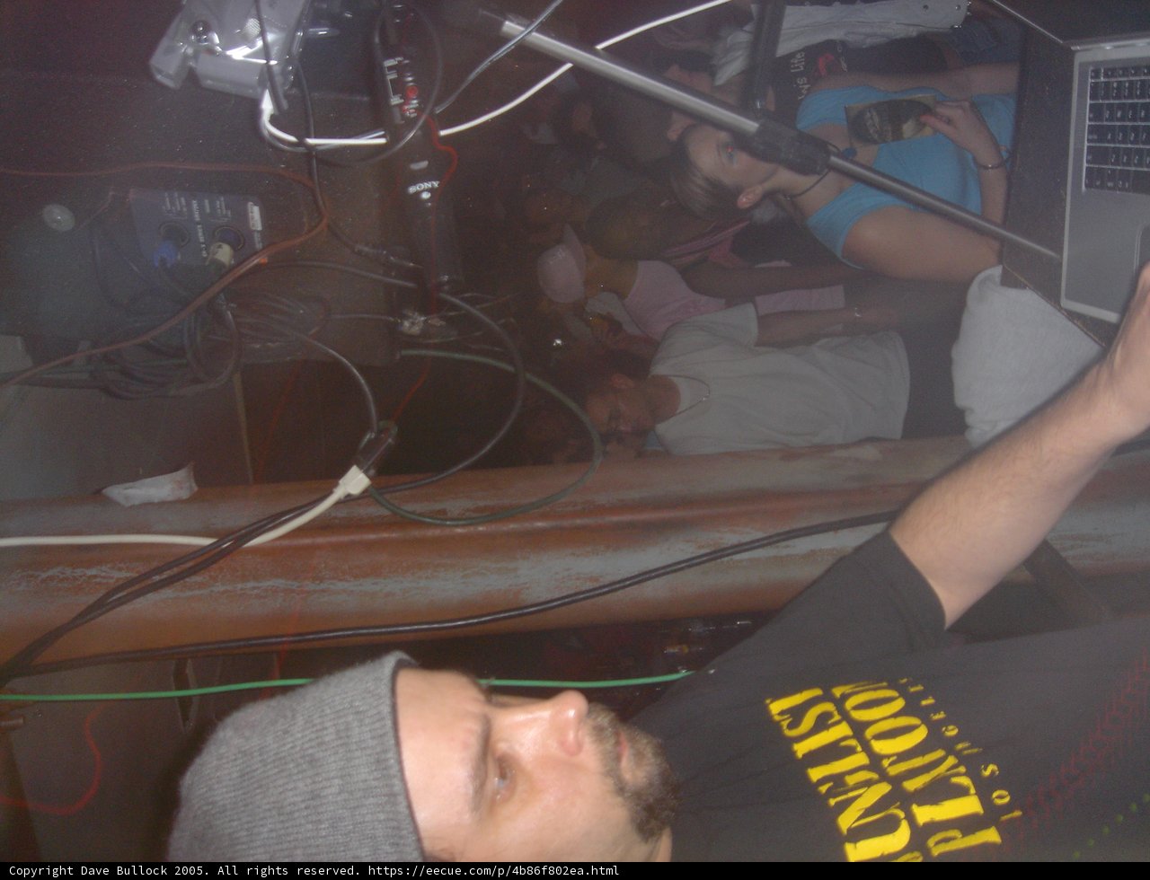 Black Shirted Man with Microphone in Club