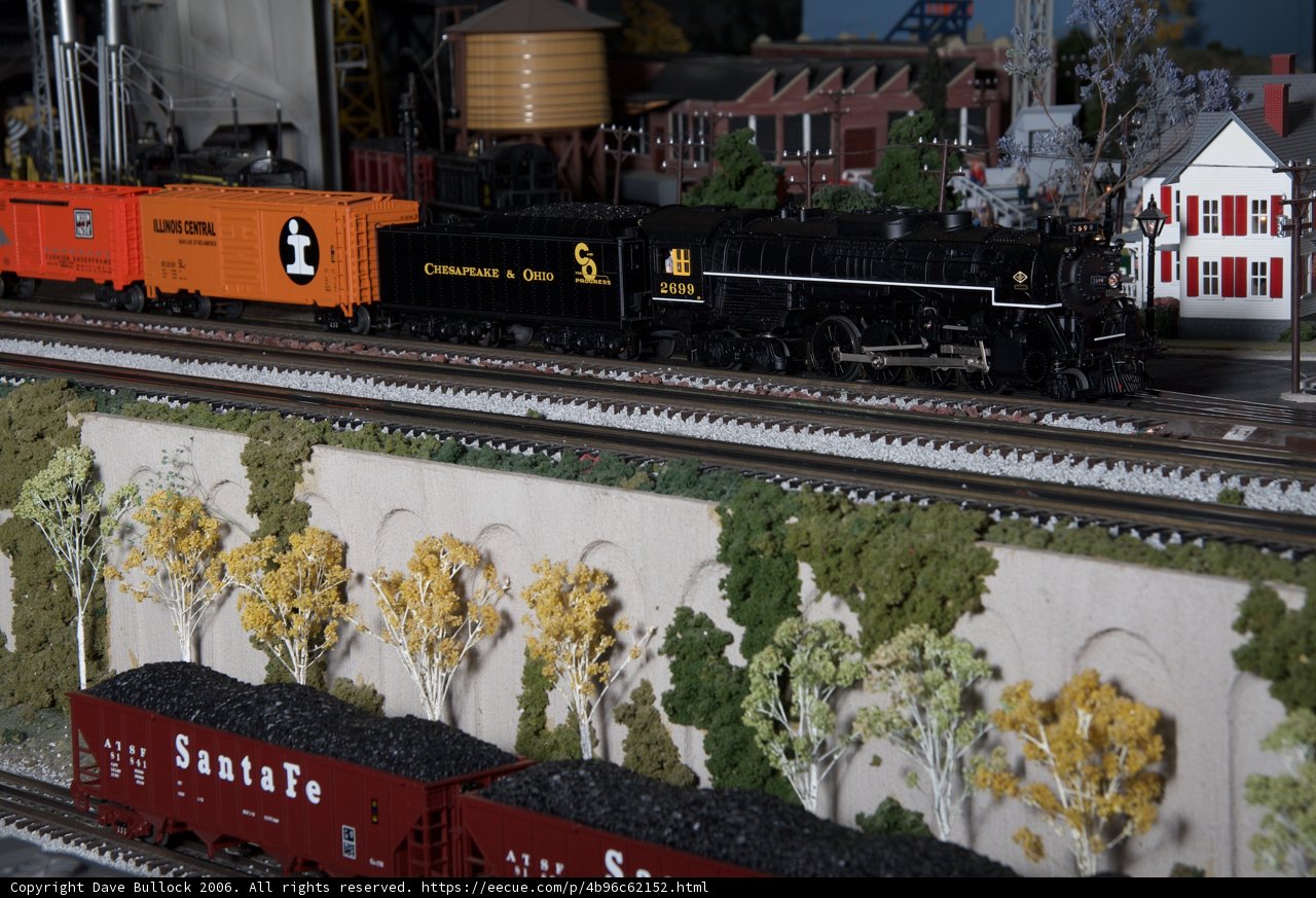 11-wheeled toy train on railway diorama