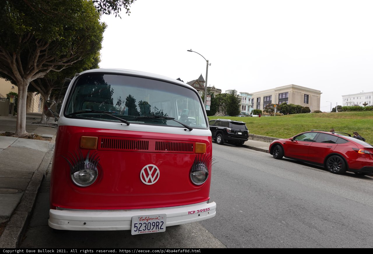 Classic Red and White VW Bus on the Side of the Road