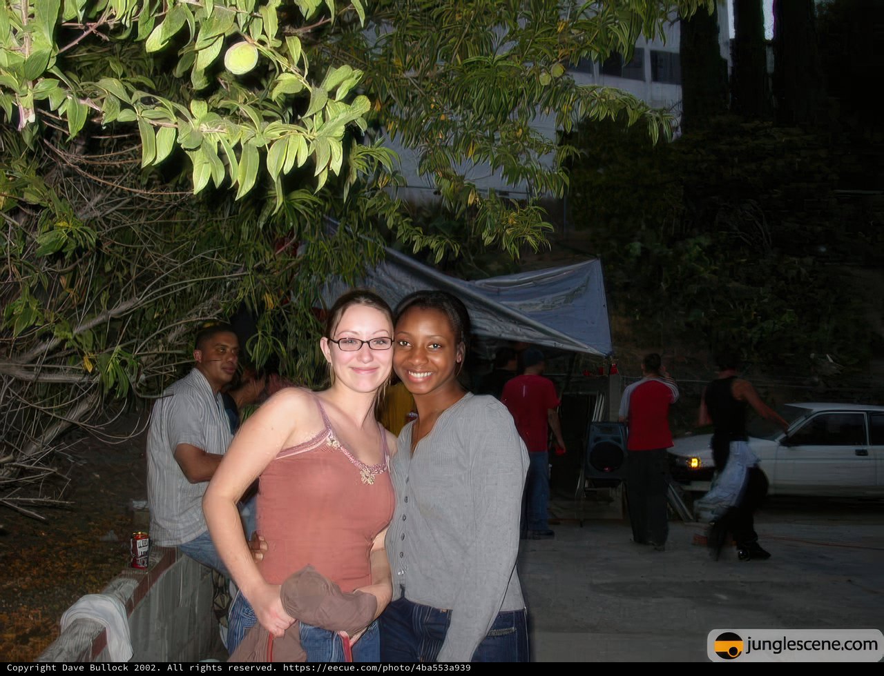 Urban Portrait of Two Women Standing in Front of a Tree