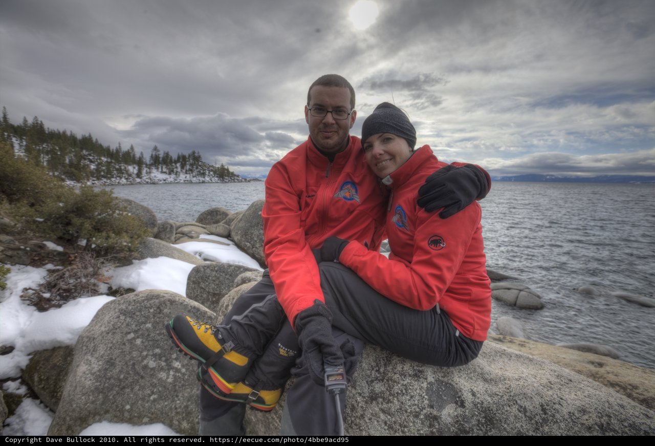 Couple Embracing on Snowy Lake Tahoe Shoreline