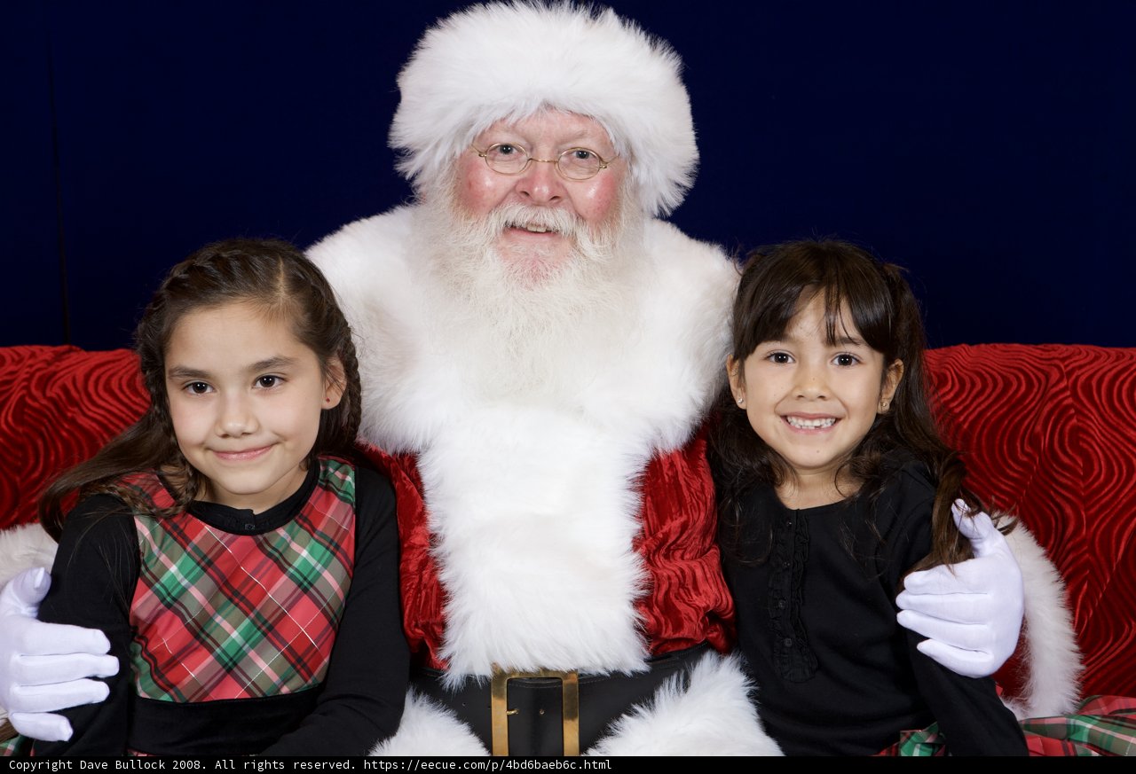 Santa Claus Celebrates Christmas with Two Girls