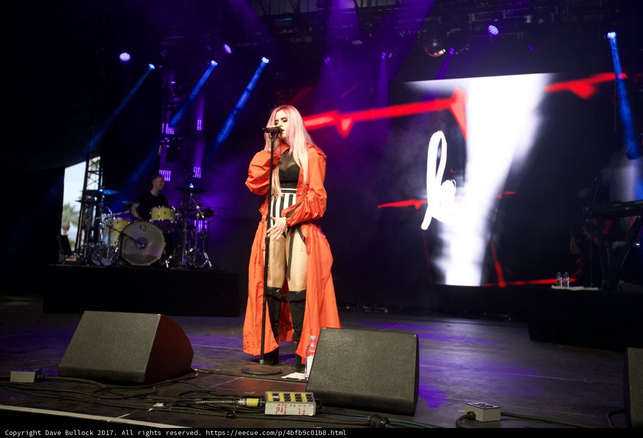 The Orange Dress Caressing the Stage
