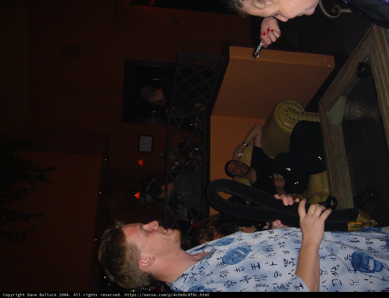 Man in Blue Shirt at Downtown Pub
